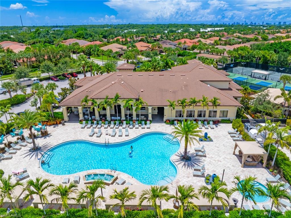 13750 Callisto Avenue Naples, FL 34109 - Photo 34 of 46 an aerial view of house with yard swimming pool and outdoor seating