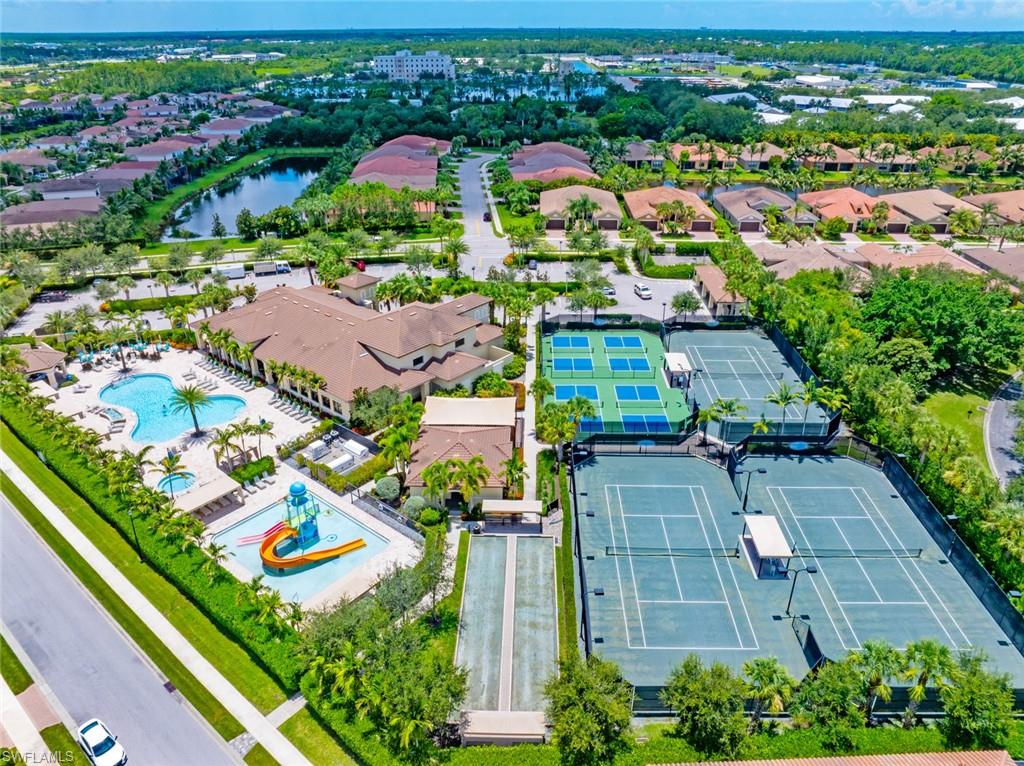 13750 Callisto Avenue Naples, FL 34109 - Photo 36 of 46 an aerial view of residential houses with outdoor space and street view