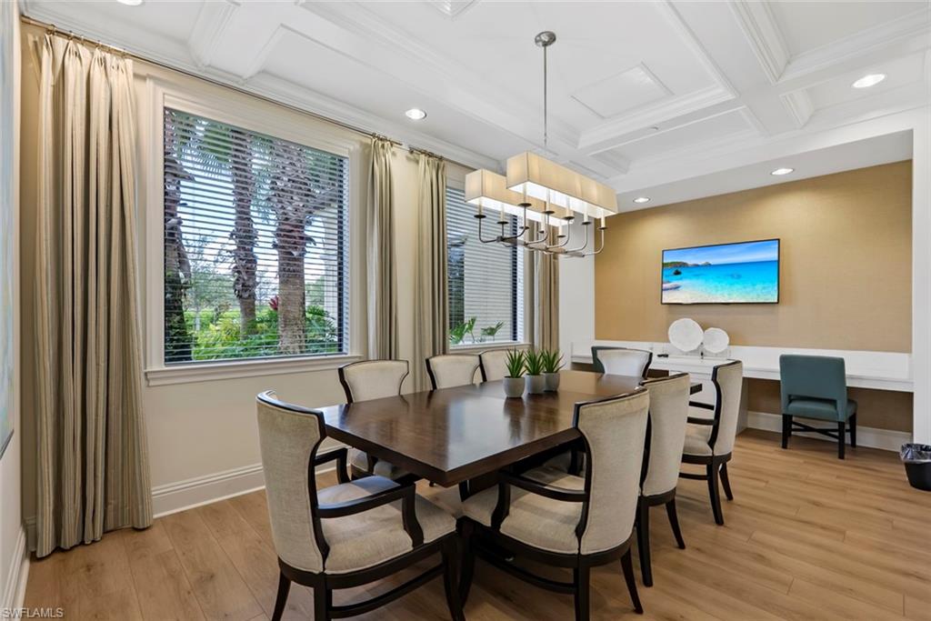 13750 Callisto Avenue Naples, FL 34109 - Photo 38 of 46 a view of a dining room with furniture window and wooden floor