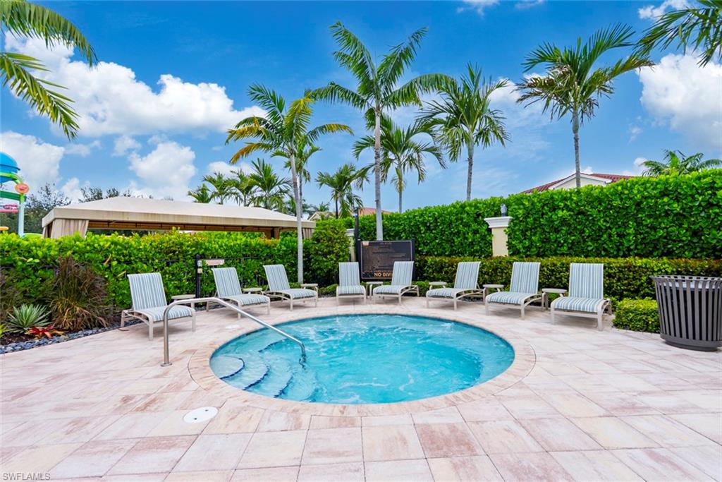 13750 Callisto Avenue Naples, FL 34109 - Photo 40 of 46 a view of a swimming pool with chairs