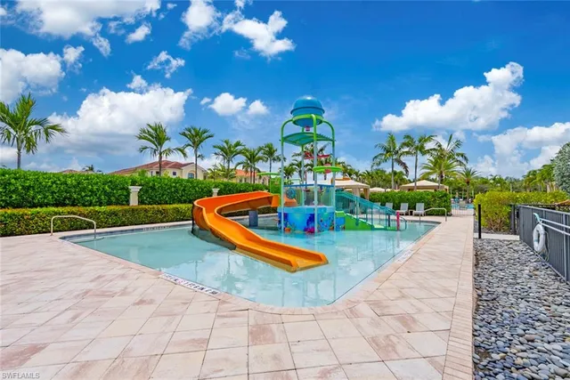 a view of a swimming pool with chairs