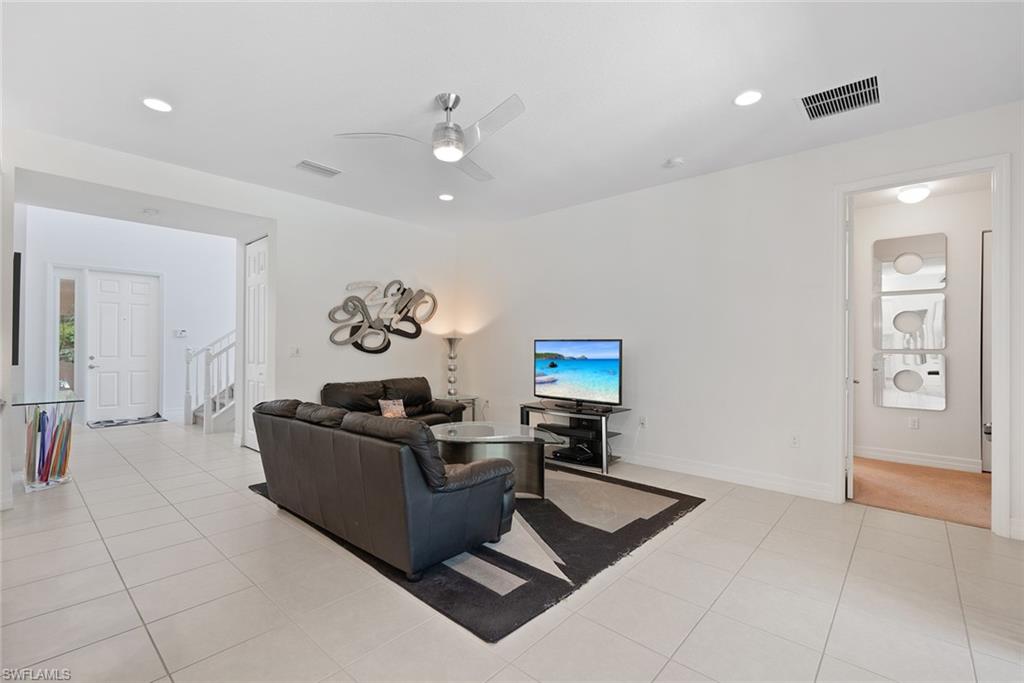 13750 Callisto Avenue Naples, FL 34109 - Photo 10 of 46 a living room with furniture