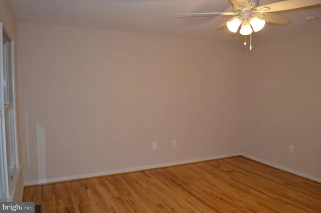 a view of livingroom with furniture wooden floor and window