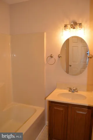 an empty room with wooden floor and closet