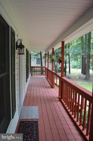 a view of a balcony with wooden floor