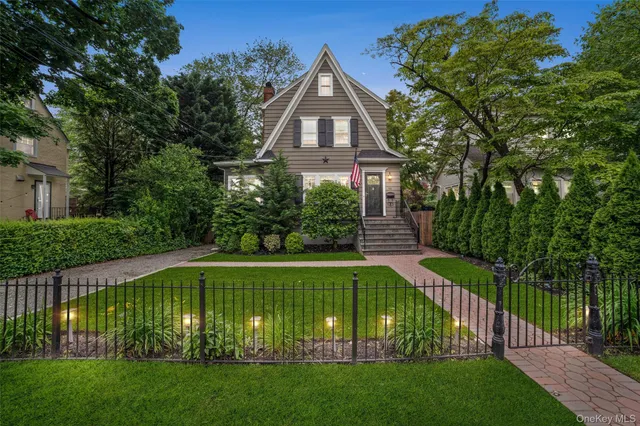 a front view of a house with garden