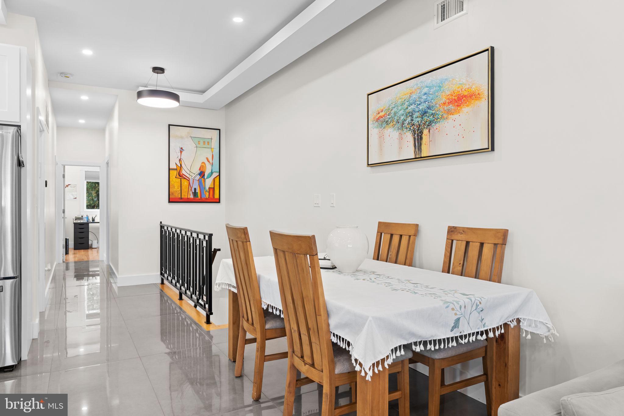 9975 Woodfern Road Philadelphia, PA 19115 - Photo 11 of 35 a view of a dining room with furniture and wooden floor
