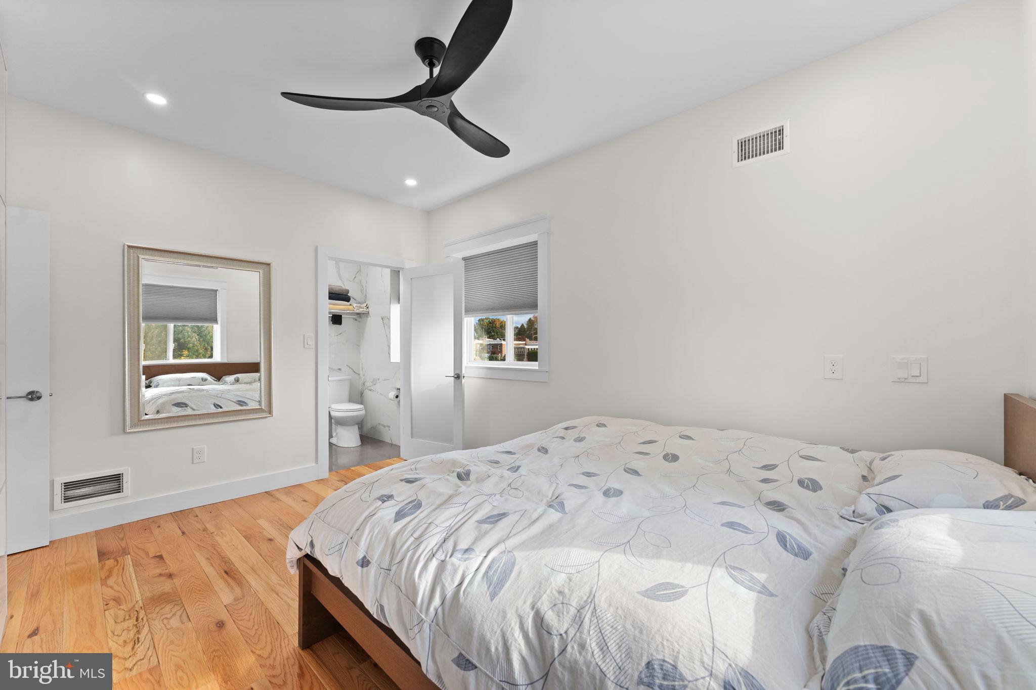 9975 Woodfern Road Philadelphia, PA 19115 - Photo 18 of 35 a bedroom with a bed and a painting on the wall