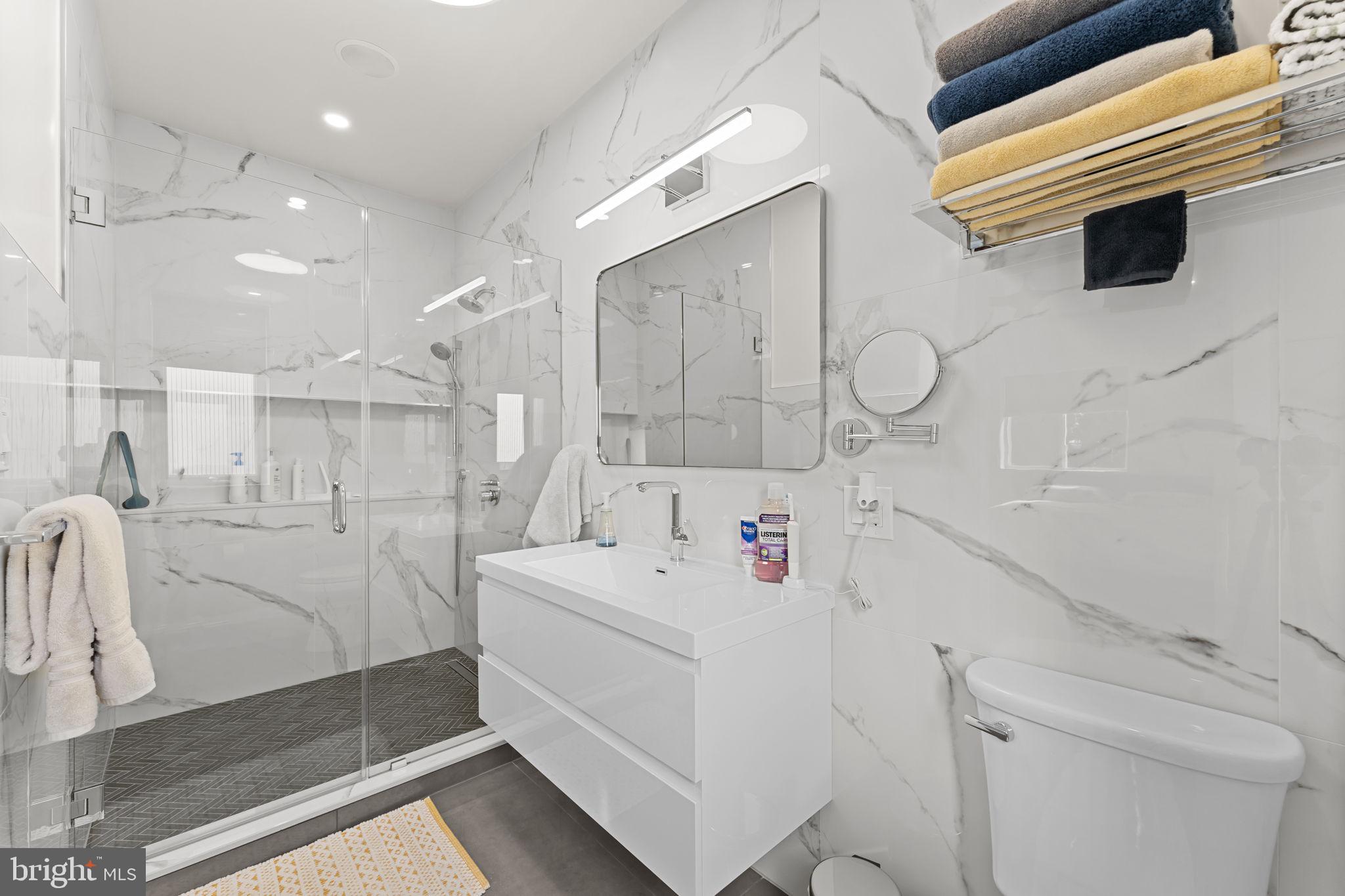 9975 Woodfern Road Philadelphia, PA 19115 - Photo 19 of 35 a bathroom with a sink a toilet and shower