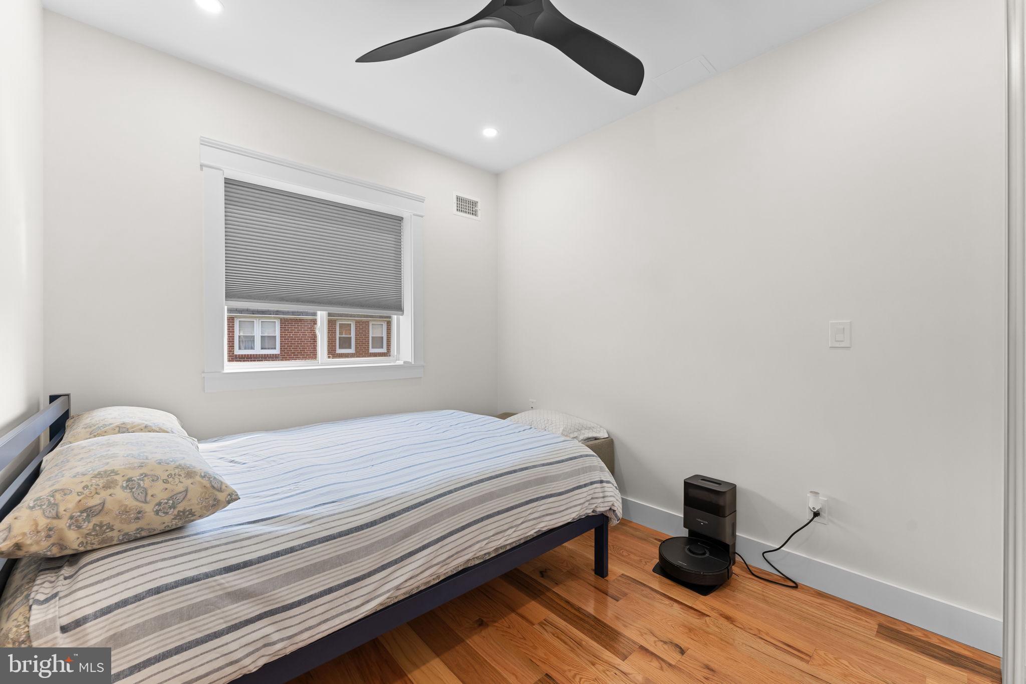 9975 Woodfern Road Philadelphia, PA 19115 - Photo 20 of 35 a bedroom with a bed and wooden floor