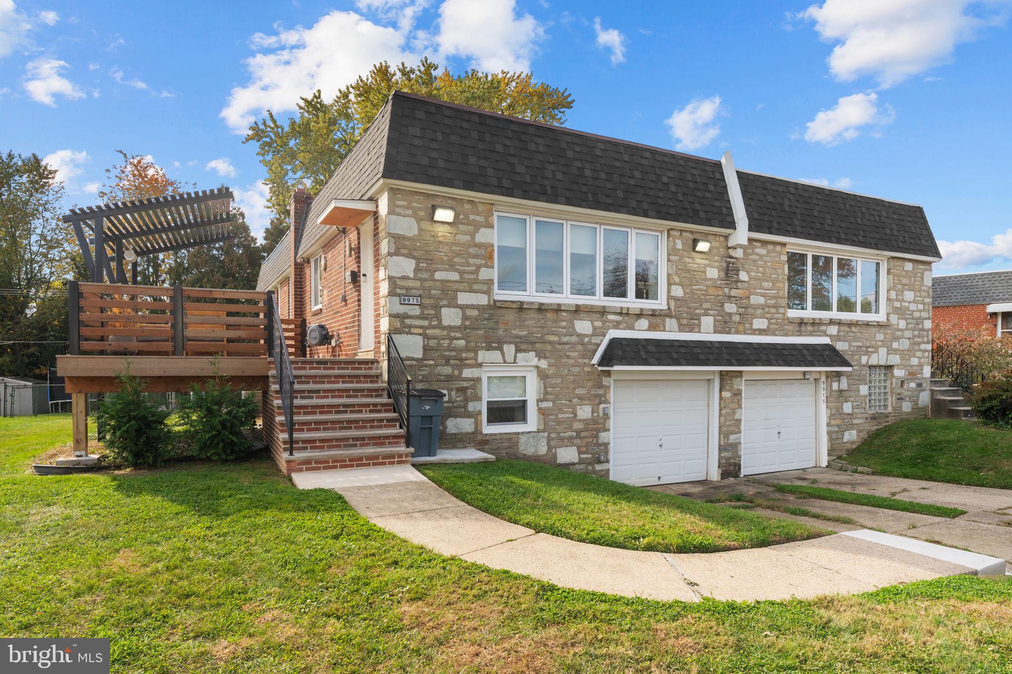 9975 Woodfern Road Philadelphia, PA 19115 - Photo 2 of 35 a view of a house with a yard