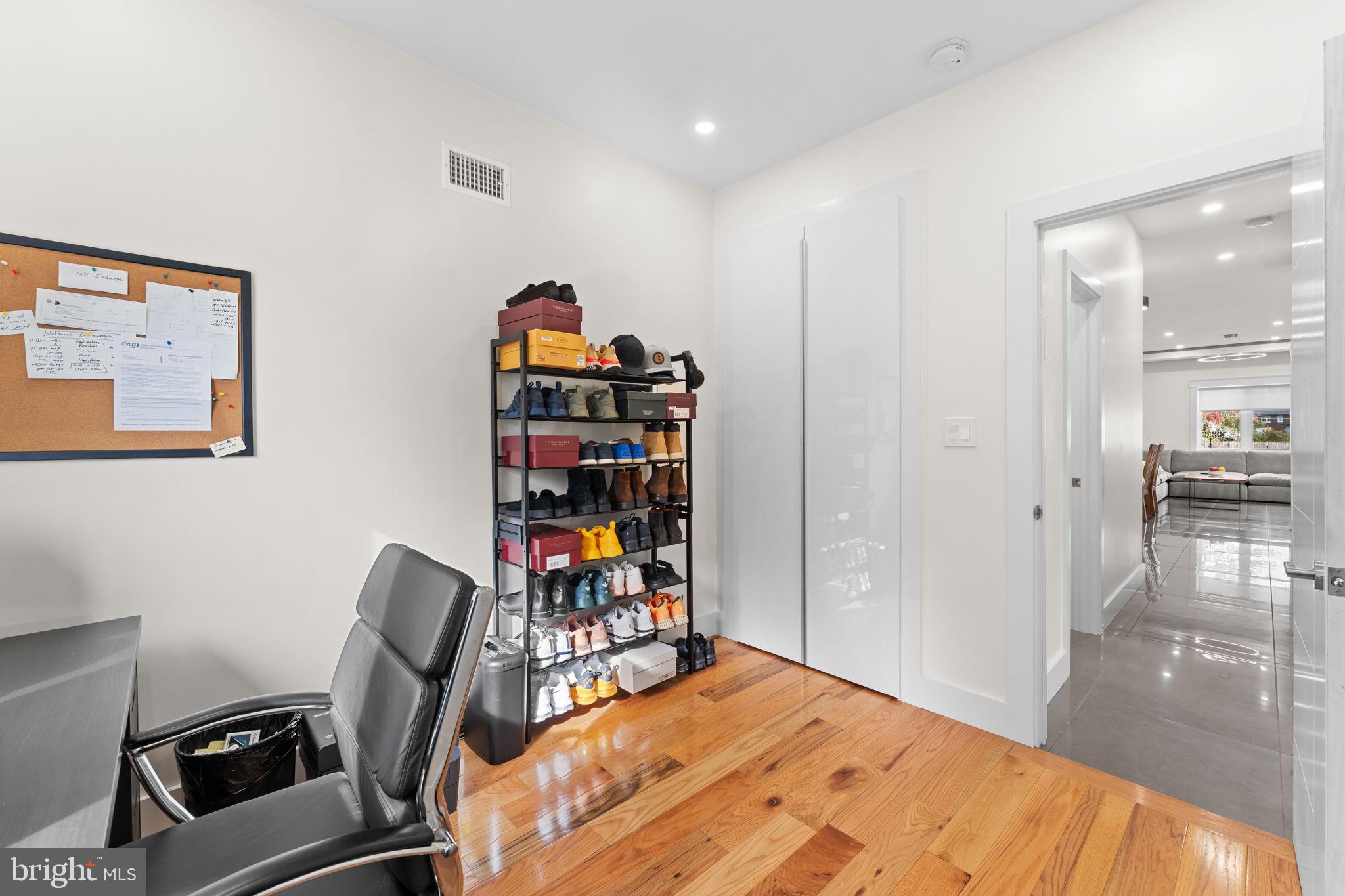 9975 Woodfern Road Philadelphia, PA 19115 - Photo 23 of 35 a bedroom with furniture and a book shelf