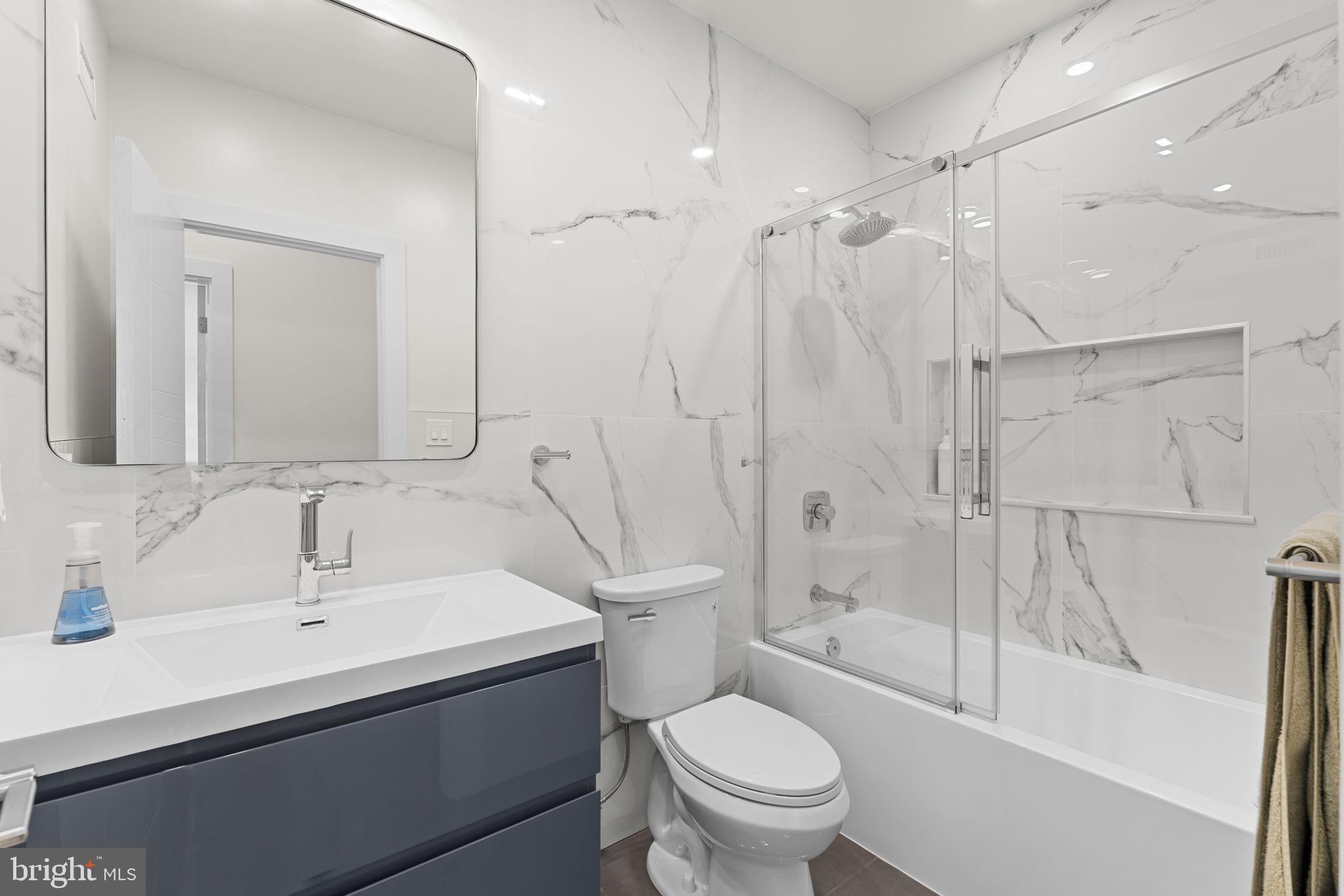 9975 Woodfern Road Philadelphia, PA 19115 - Photo 24 of 35 a bathroom with a sink toilet and shower