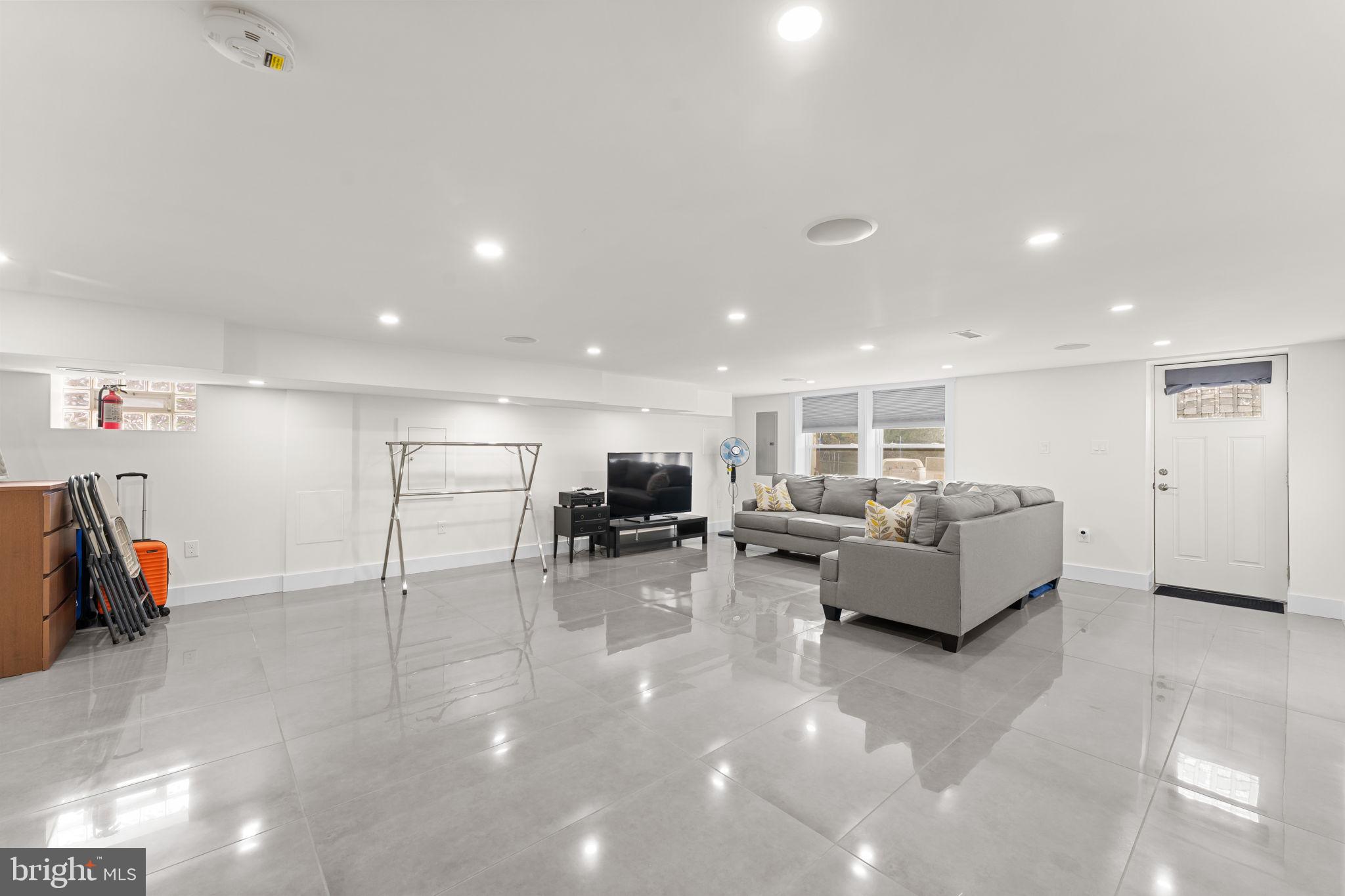 9975 Woodfern Road Philadelphia, PA 19115 - Photo 25 of 35 a living room with furniture and a flat screen tv