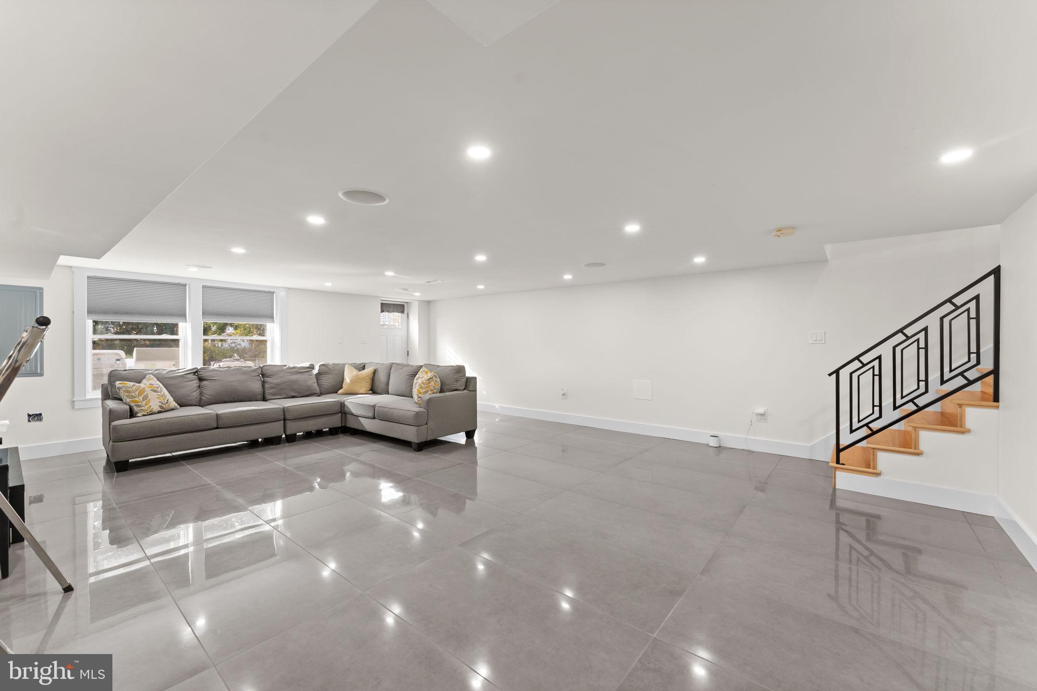 9975 Woodfern Road Philadelphia, PA 19115 - Photo 26 of 35 a living room with furniture and a ceiling fan
