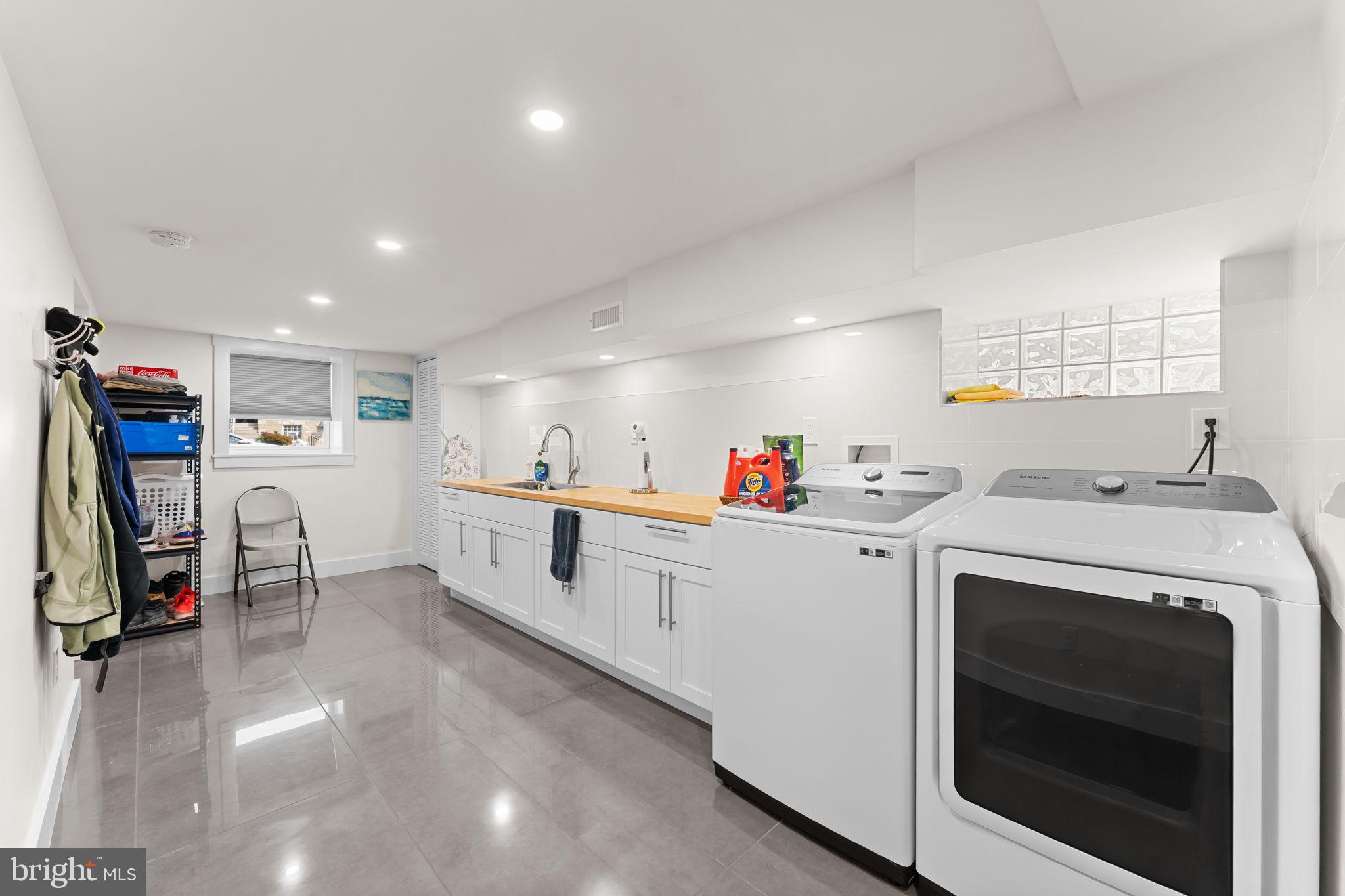 9975 Woodfern Road Philadelphia, PA 19115 - Photo 30 of 35 a kitchen with white cabinets and white appliances