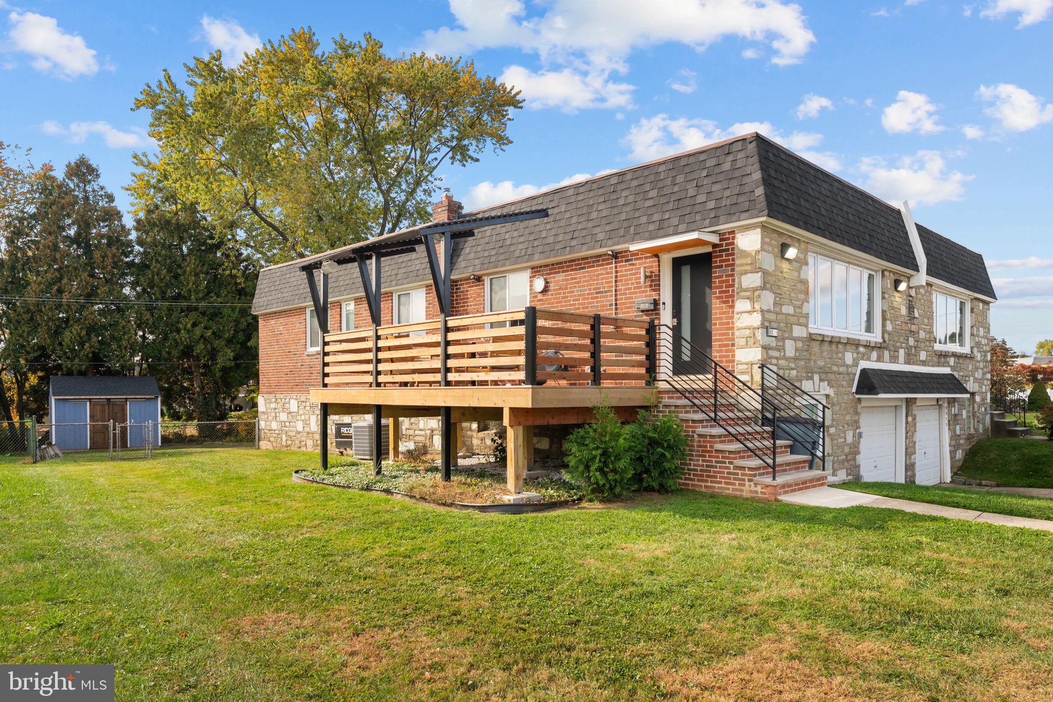 9975 Woodfern Road Philadelphia, PA 19115 - Photo 3 of 35 a front view of a house with a yard