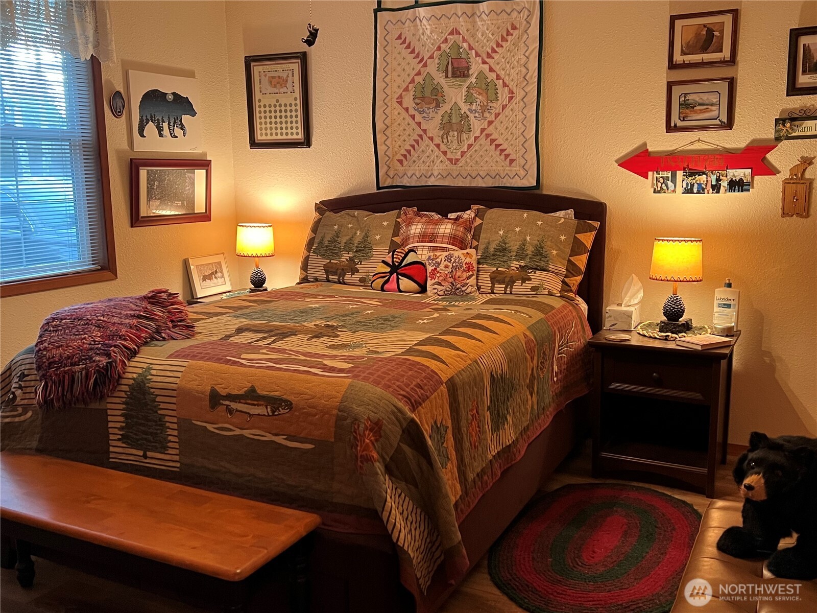 4084 Deep Lake Boundary Road Colville, WA 99114 - Photo 17 of 40 a bedroom with a bed and a painting on the wall