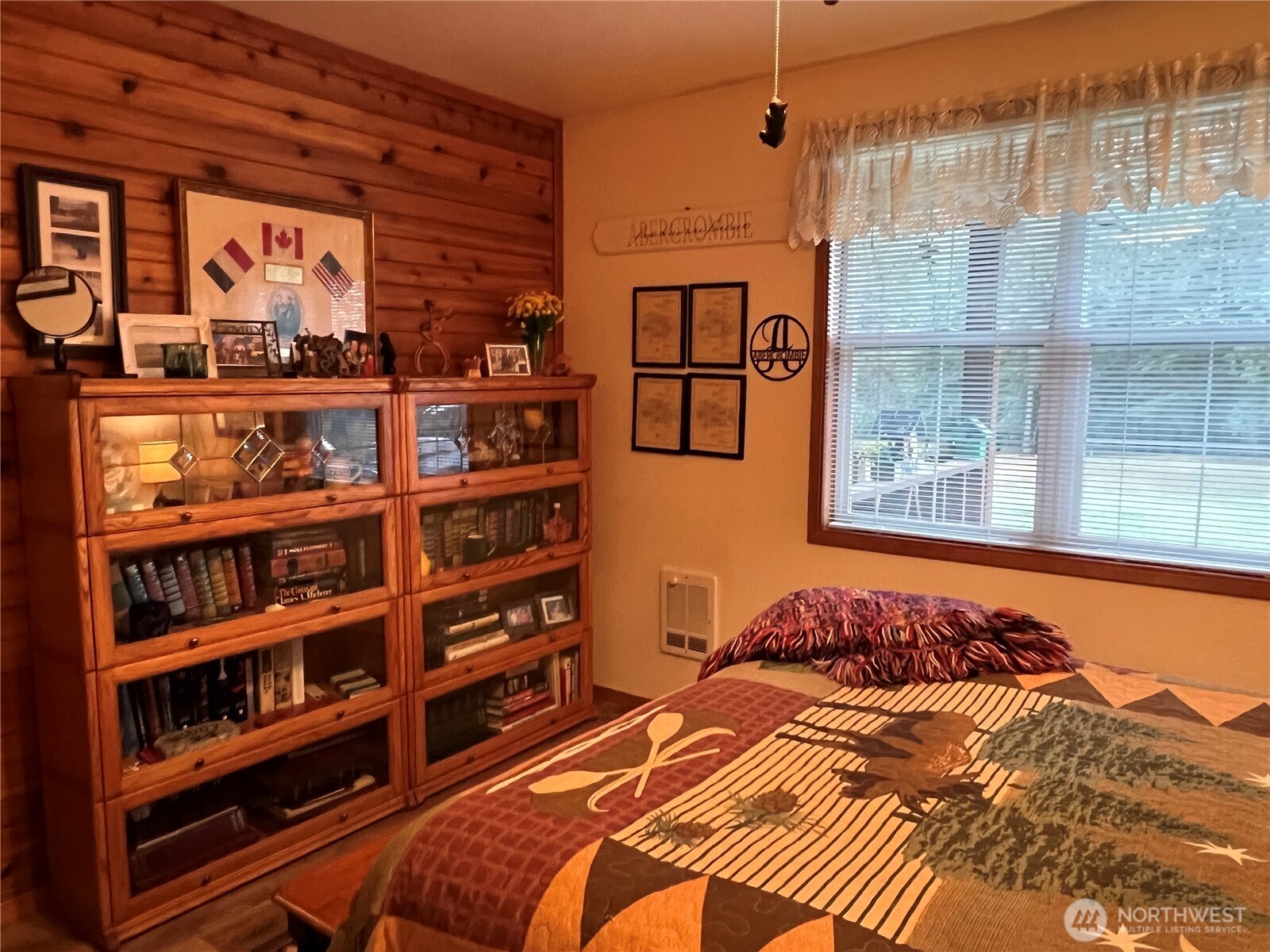 4084 Deep Lake Boundary Road Colville, WA 99114 - Photo 18 of 40 a bedroom with a bed and a book shelf