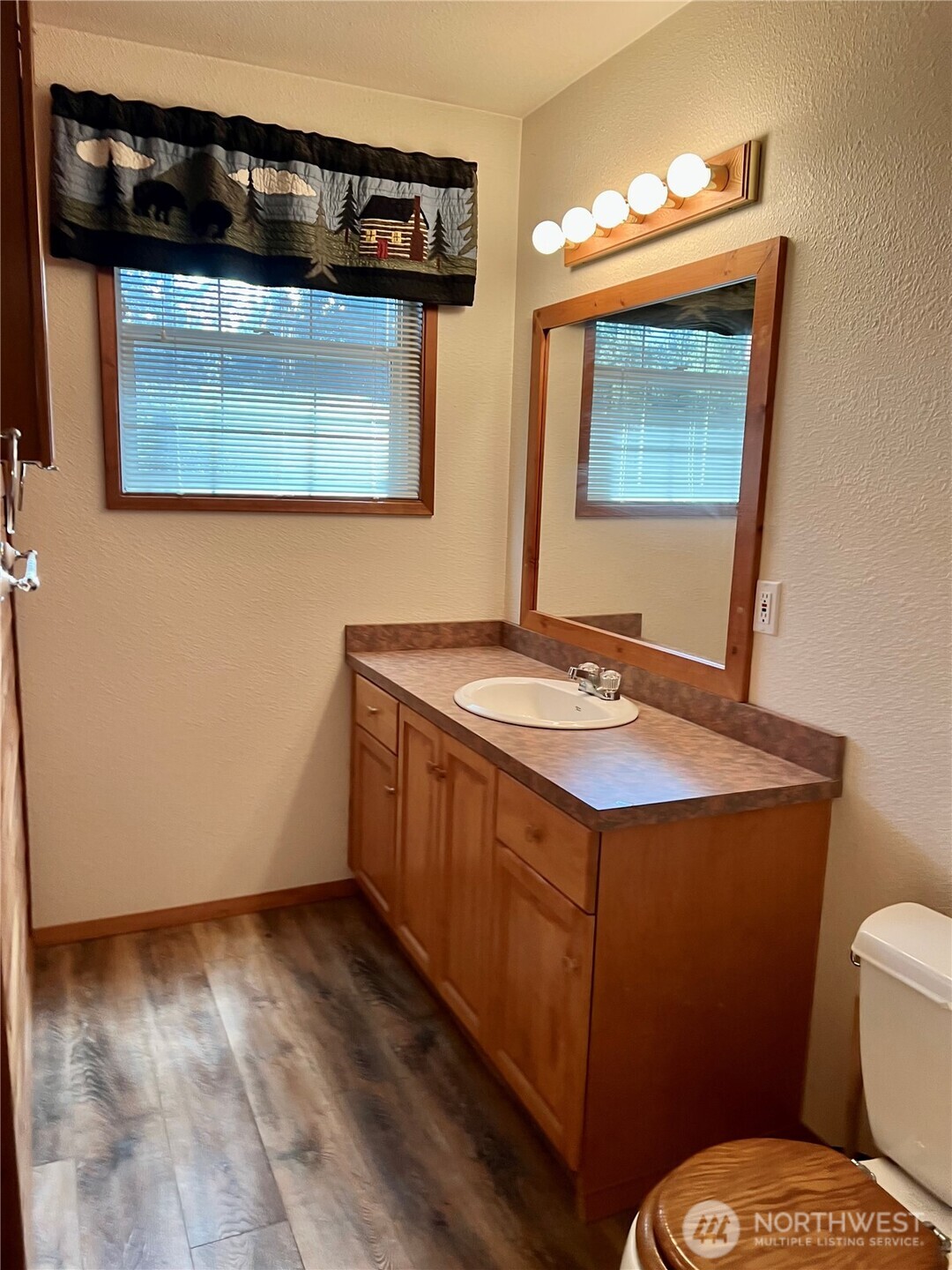 4084 Deep Lake Boundary Road Colville, WA 99114 - Photo 20 of 40 a bathroom with a sink a toilet and mirror