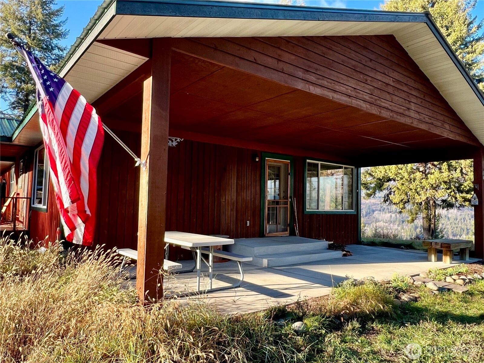 4084 Deep Lake Boundary Road Colville, WA 99114 - Photo 24 of 40 a view of a chairs and table in the patio