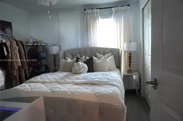 a bedroom with a bed and a tv