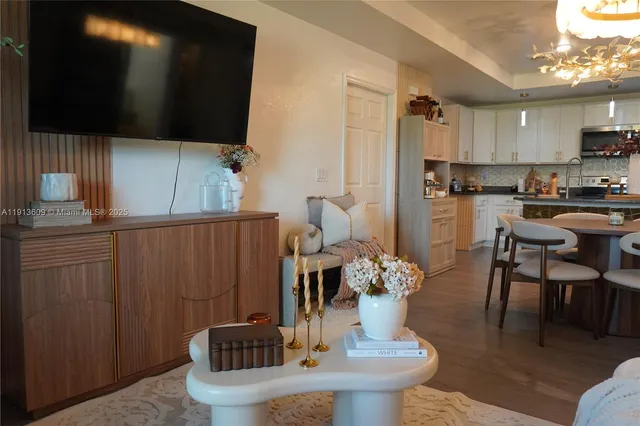 a kitchen with a table chairs and entryway
