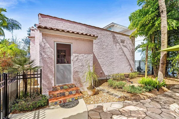 a front view of a house with garden