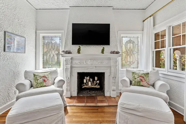 a living room with furniture and a fireplace