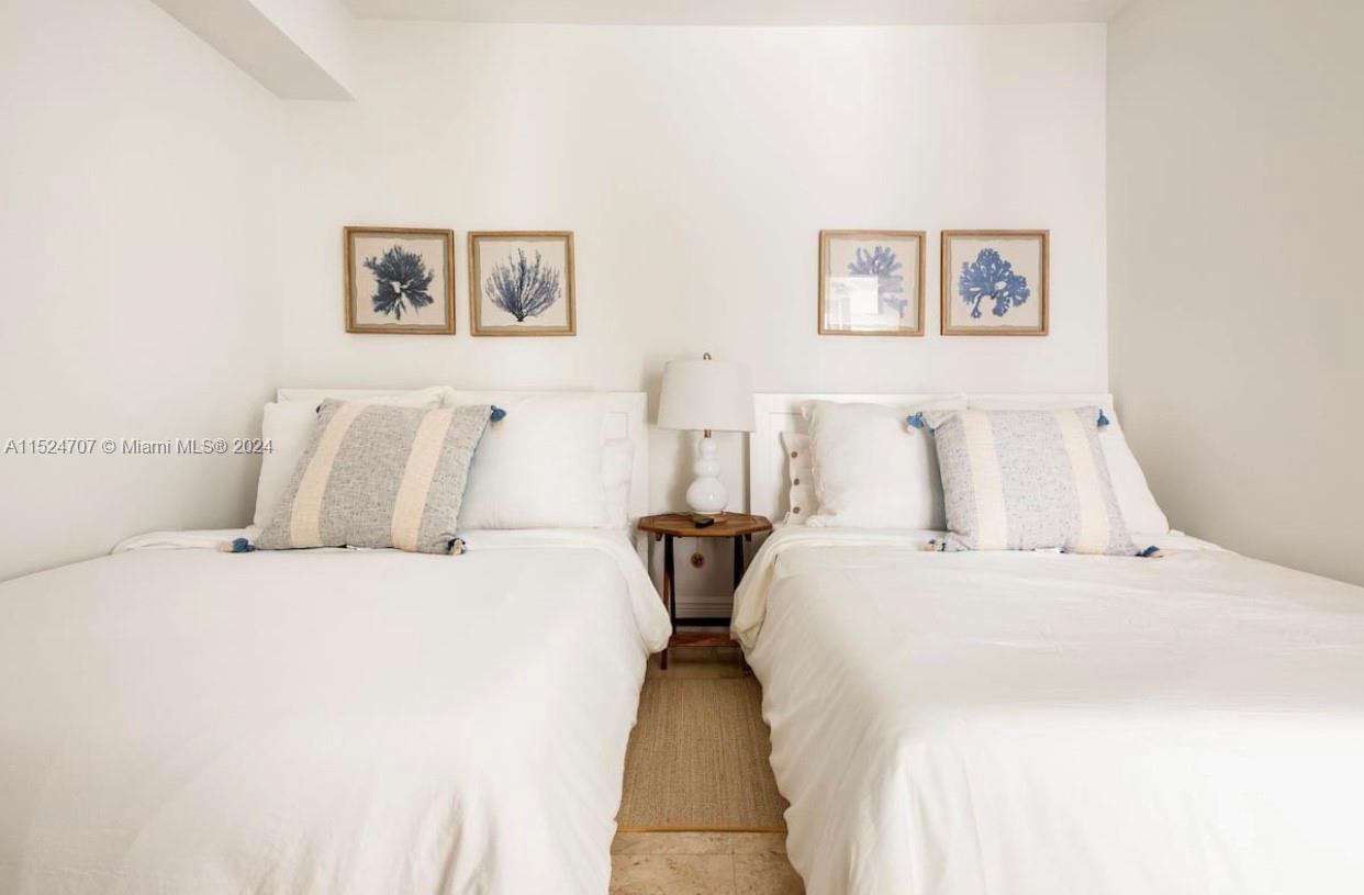 Village of Key Biscayne Key Biscayne, FL 33149 - Photo 2 of 13 a bedroom with double bed and wall painting