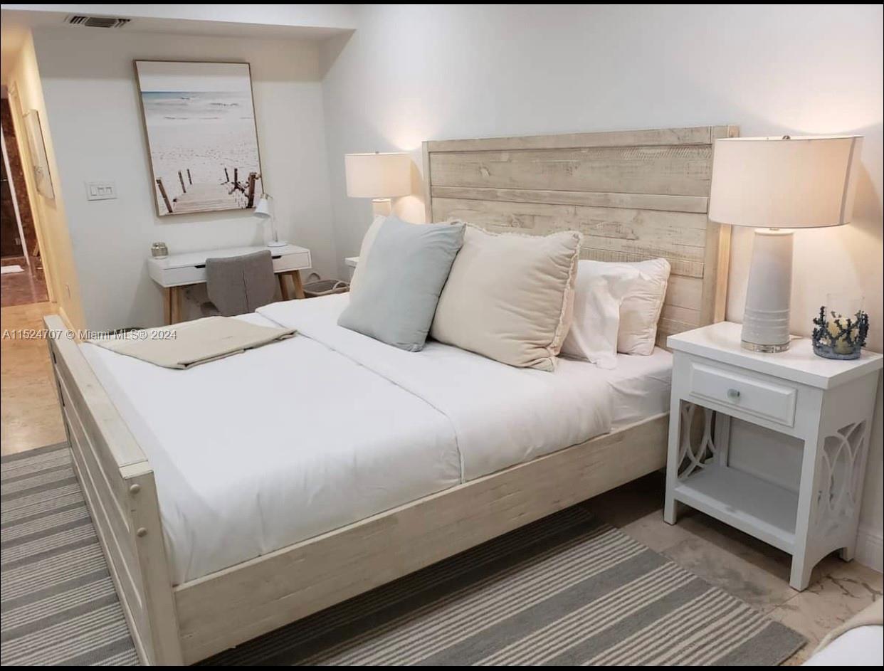 Village of Key Biscayne Key Biscayne, FL 33149 - Photo 5 of 13 a large white bed in a white room