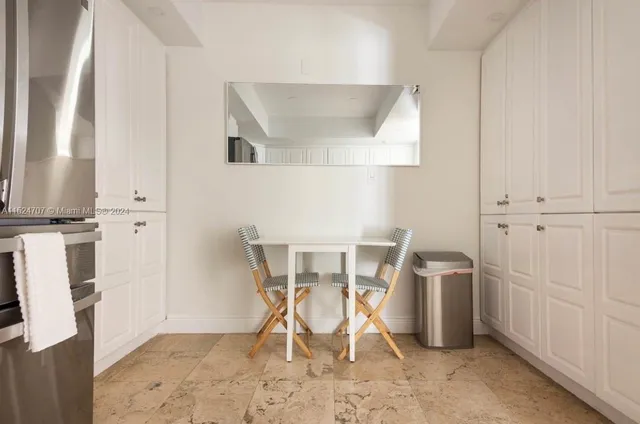 a view of a kitchen with appliances and cabinets