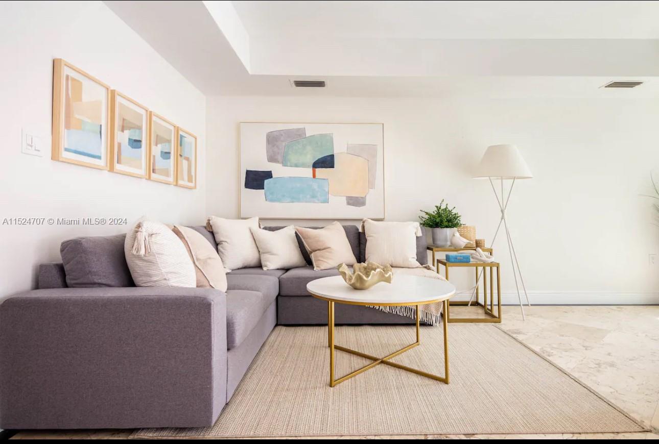 Village of Key Biscayne Key Biscayne, FL 33149 - Photo 9 of 13 a living room with furniture and a lamp