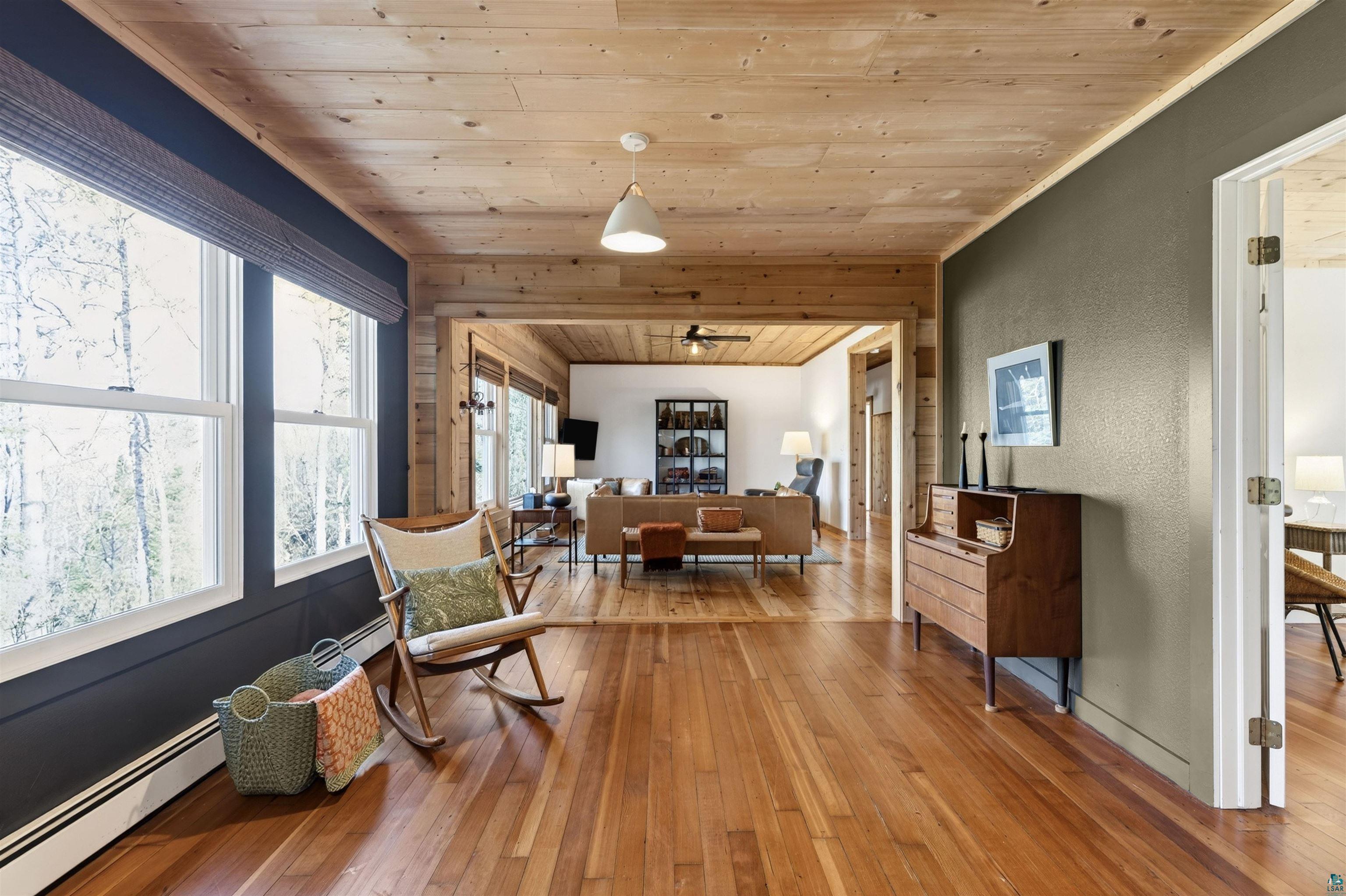13885 Park Road Brule, WI 54820 - Photo 10 of 41 Wood-finish flooring extending throughout, complemented by a wood-paneled ceiling