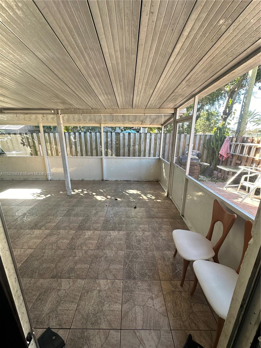 3196 West 79th Place Hialeah, FL 33018 - Photo 15 of 19 a view of a chairs in balcony