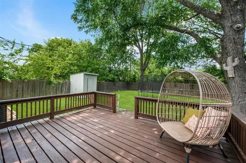 a view of a wooden deck with a bench