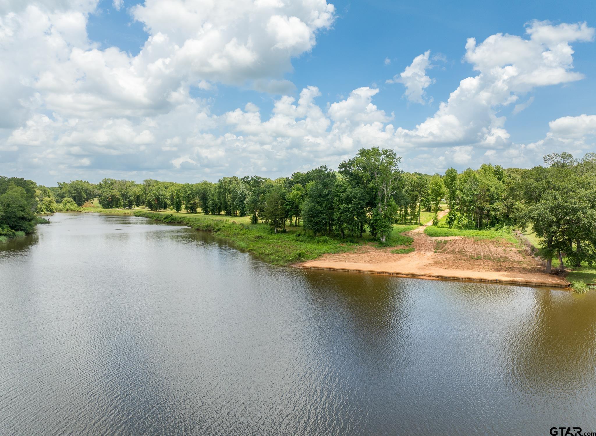 885 Stone Chimney Road Bullard, TX 75757 - Photo 2 of 7 a view of a lake with houses in the back