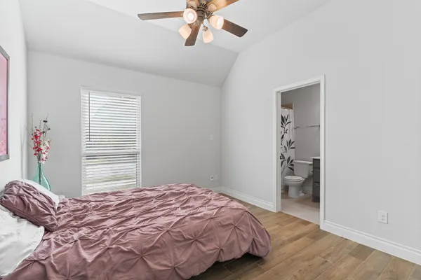 a view of a room with racks on the wall and a window