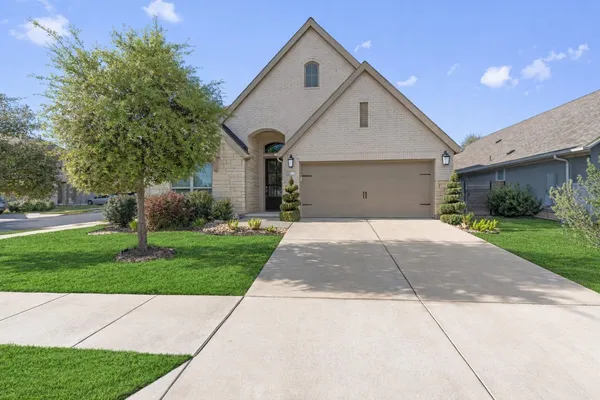 a view of a patio with a table and chairs