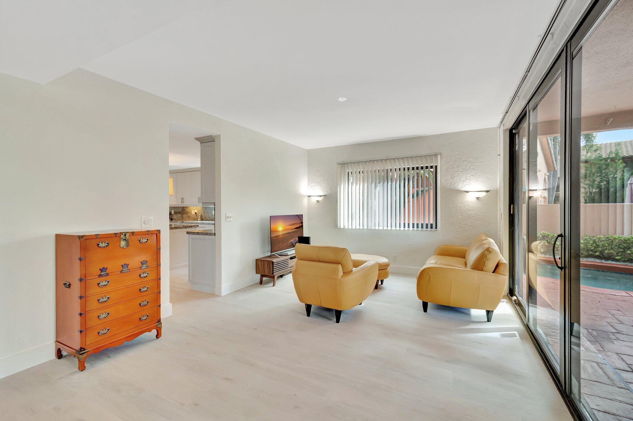6427 Via Rosa Boca Raton, FL 33433 - Photo 23 of 80 a living room with furniture and a window