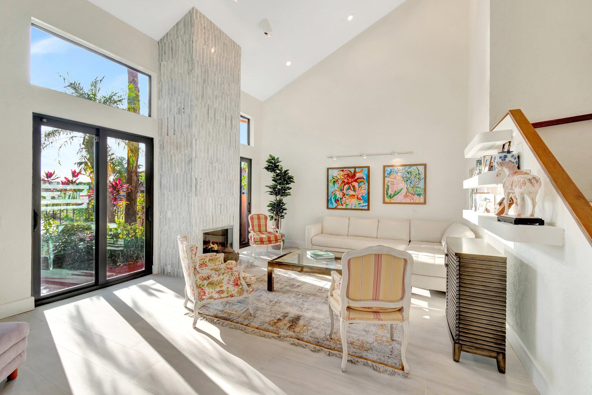 6427 Via Rosa Boca Raton, FL 33433 - Photo 31 of 80 a living room with a fireplace furniture and a large window