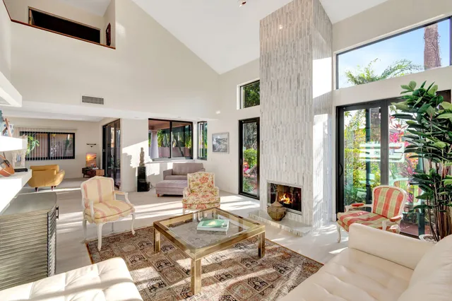 a view of a palm plant from a balcony