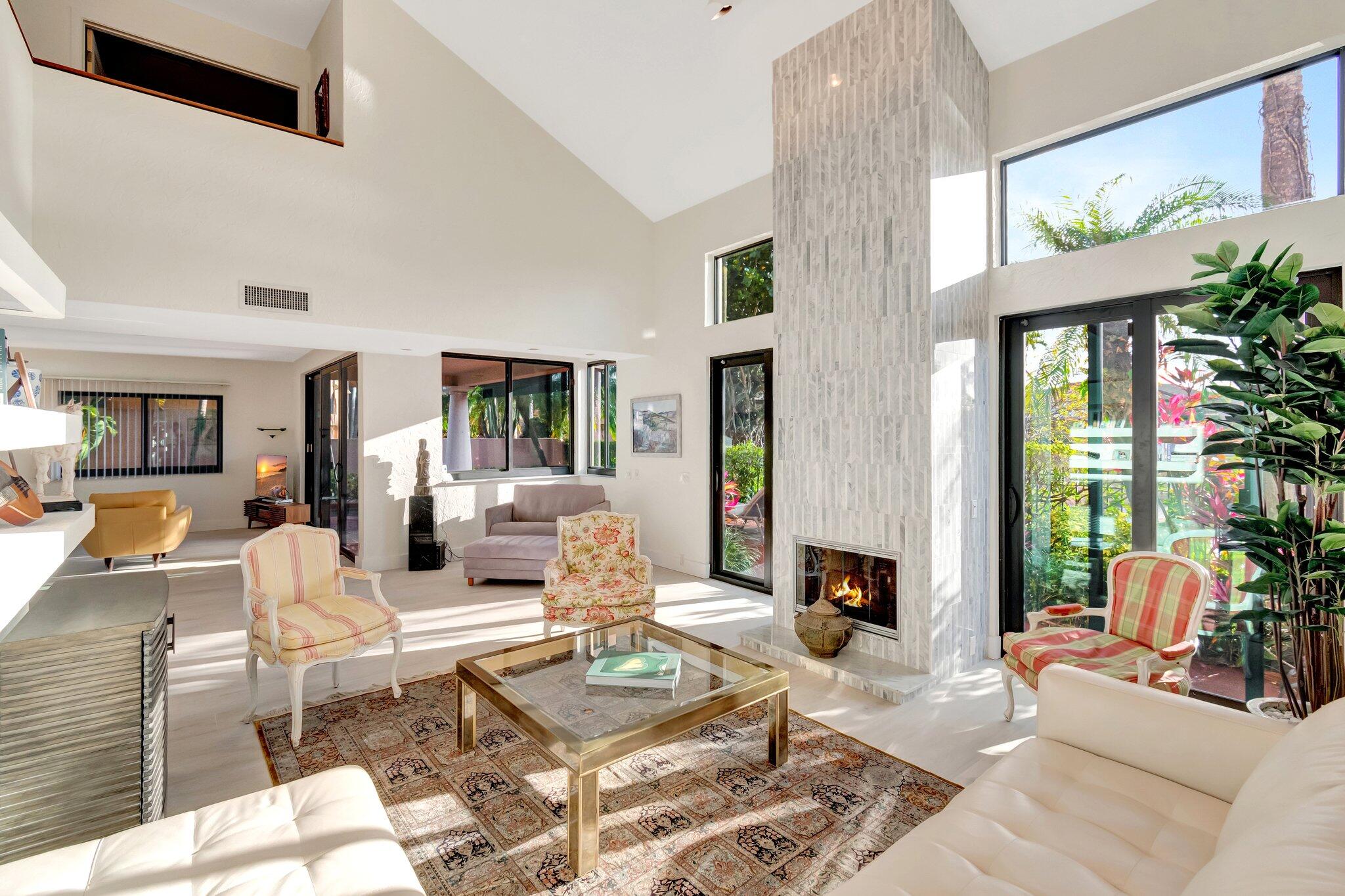 6427 Via Rosa Boca Raton, FL 33433 - Photo 33 of 80 a living room with furniture and a large window