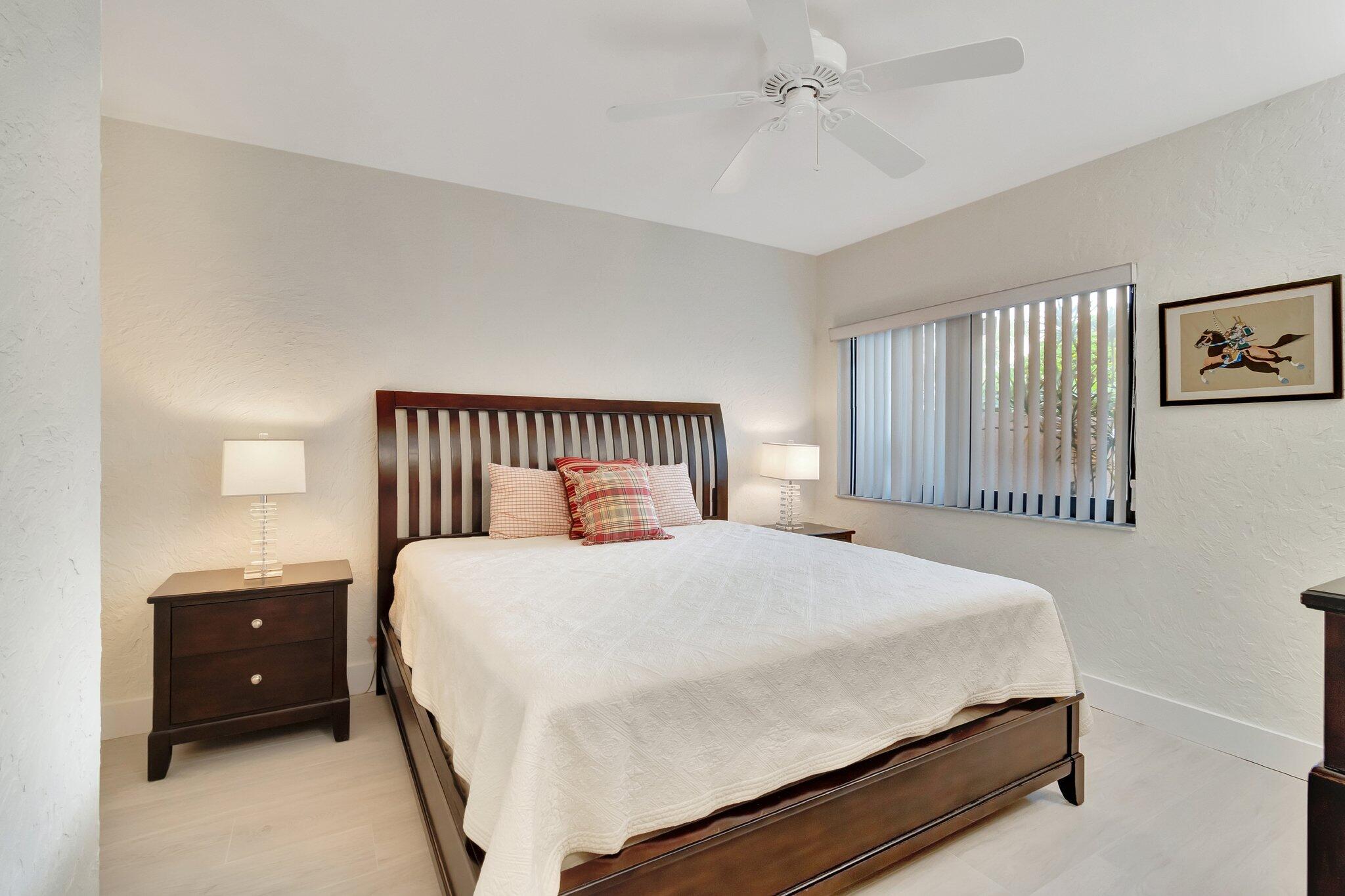 6427 Via Rosa Boca Raton, FL 33433 - Photo 37 of 80 a bedroom with a bed and window