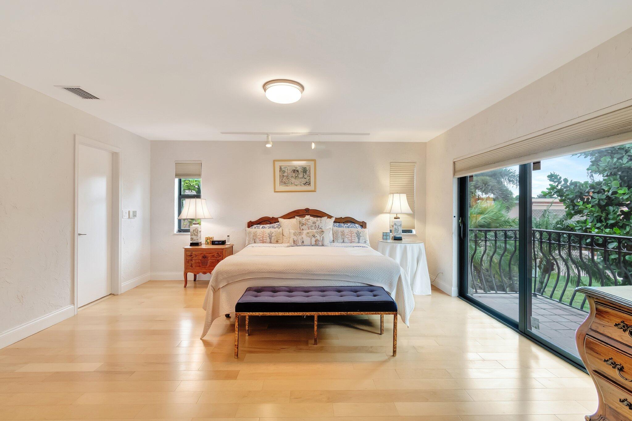 6427 Via Rosa Boca Raton, FL 33433 - Photo 43 of 80 a bedroom with a bed and large window