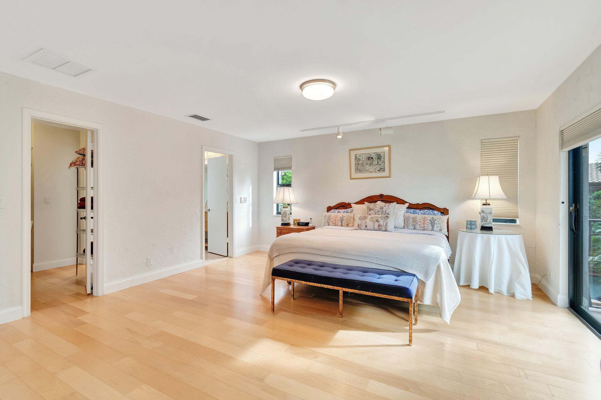 6427 Via Rosa Boca Raton, FL 33433 - Photo 44 of 80 a spacious bedroom with a bed and a cabinets