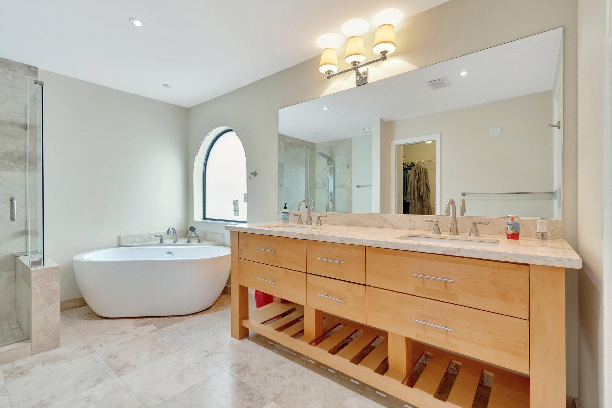 6427 Via Rosa Boca Raton, FL 33433 - Photo 45 of 80 a spacious bathroom with a double vanity sink mirror and bathtub
