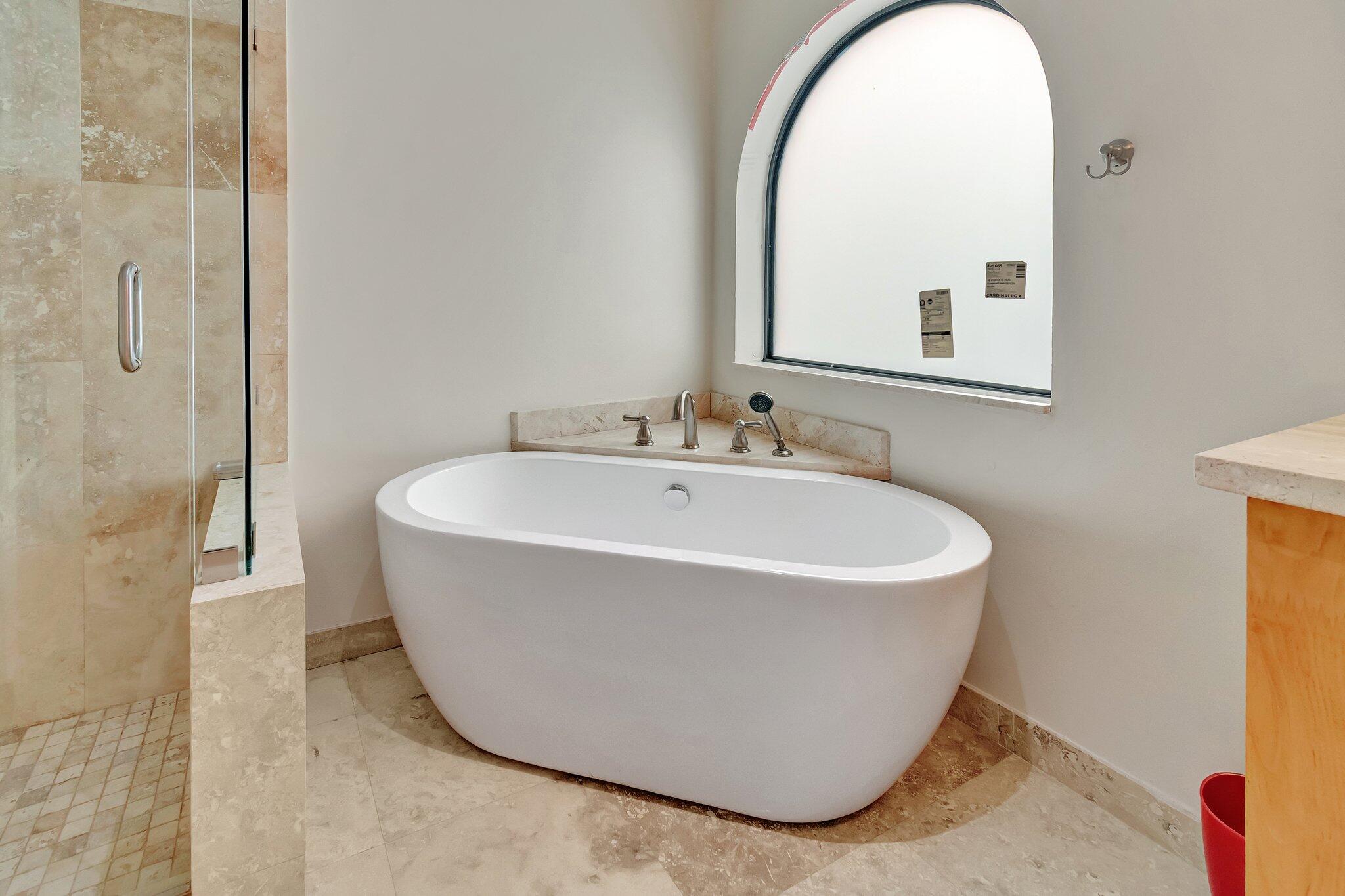 6427 Via Rosa Boca Raton, FL 33433 - Photo 46 of 80 a white bath tub sitting next to a white sink