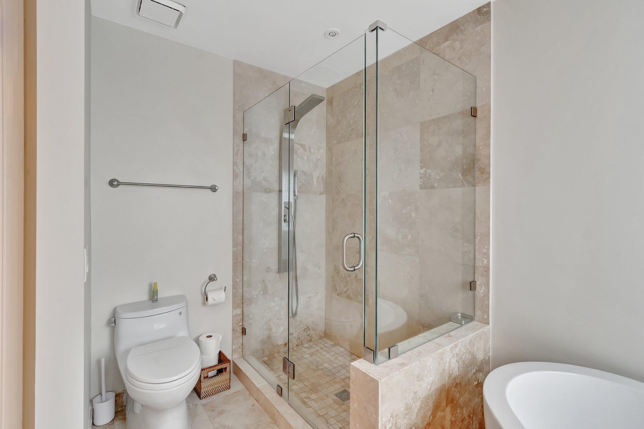 6427 Via Rosa Boca Raton, FL 33433 - Photo 47 of 80 a bathroom with a toilet and a shower