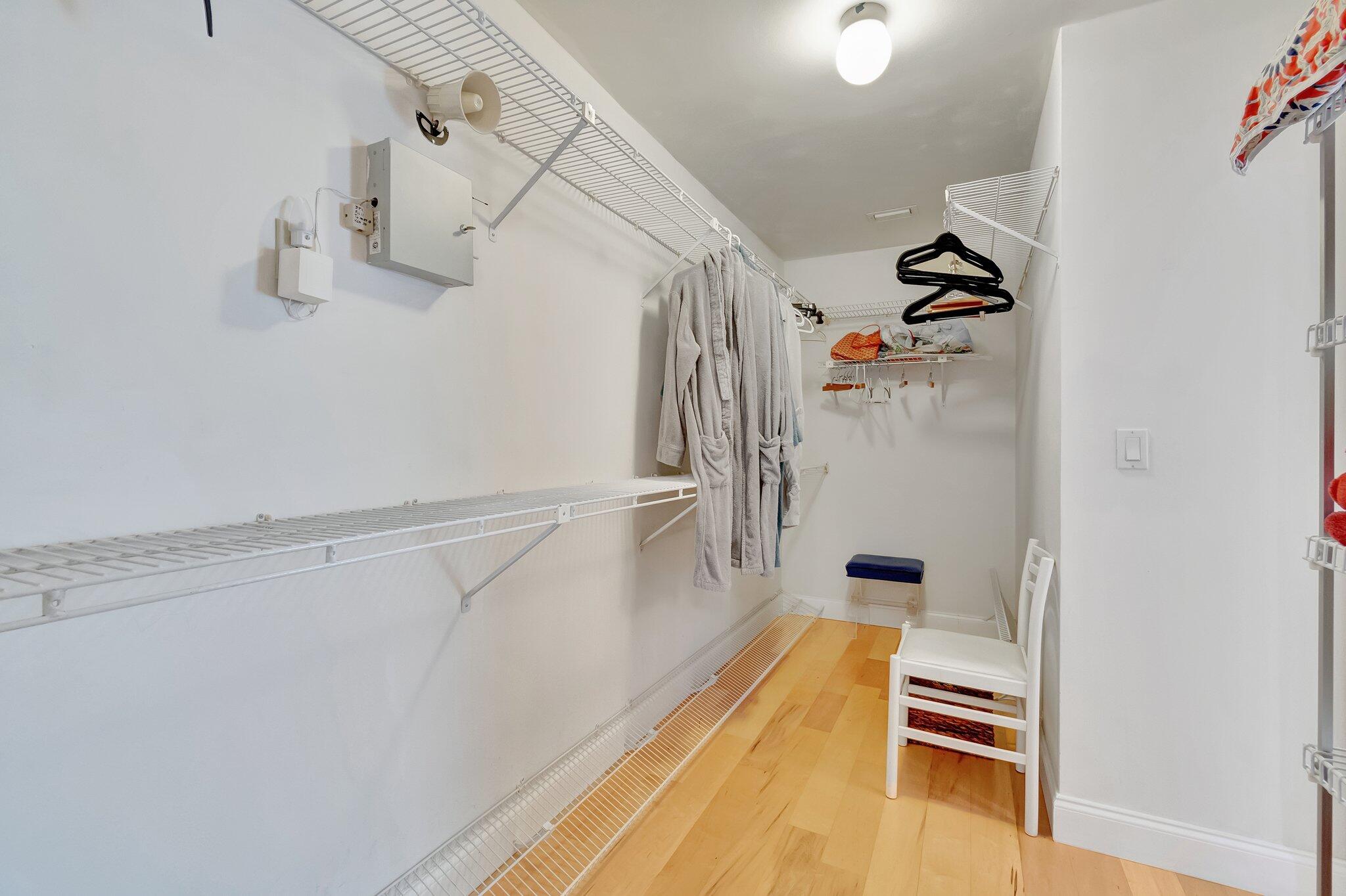 6427 Via Rosa Boca Raton, FL 33433 - Photo 48 of 80 a view of walk in closet with clothes and shoes